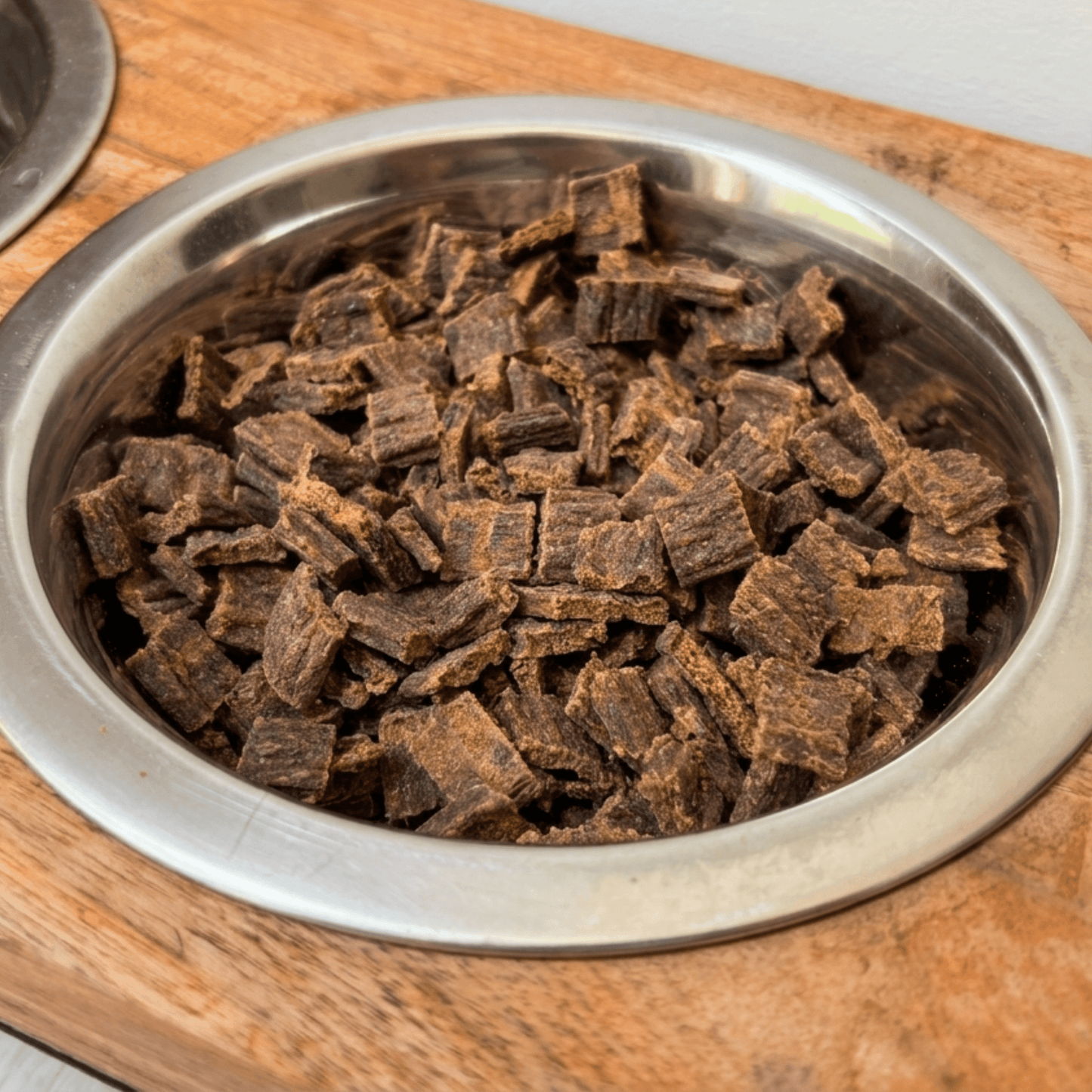 
                  
                    Air dried venison dog food in silver bowl
                  
                